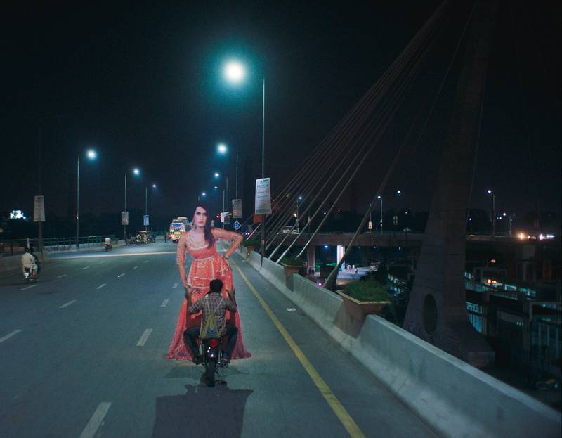 An iconic scene from ‘Joyland’, where Haider (played by Ali Junejo) is seen holding Biba’s (played by Alina Khan’s) cut-out poster | Photo courtesy of ‘Joyland’